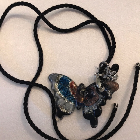 Kiara Jewelry - Brand New Glass Butterfly amulet with 24 in long braid